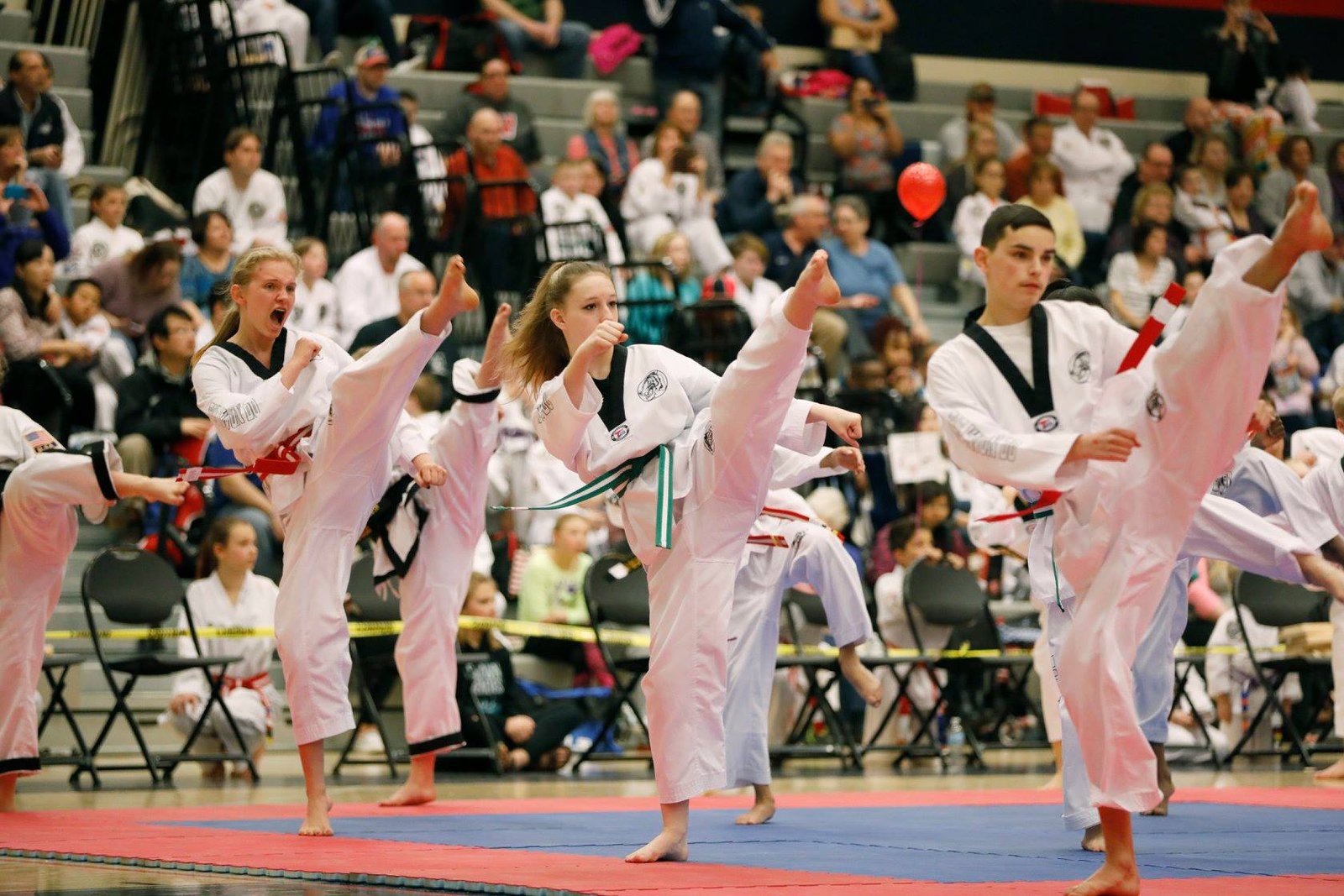 JK Lee kids class performing high kicks